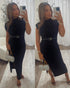 woman's belted black midi dress