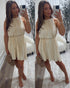 woman's pleated cream dress